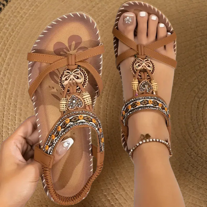 Stylish women's flat T-strap summer sandals, featuring a bohemian design, ideal for vacation comfort.