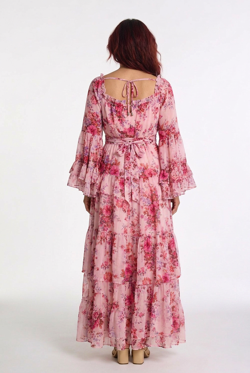 Bohemian women's maxi dress featuring vibrant floral print & stylish ruffle bell sleeves. Summer ready.