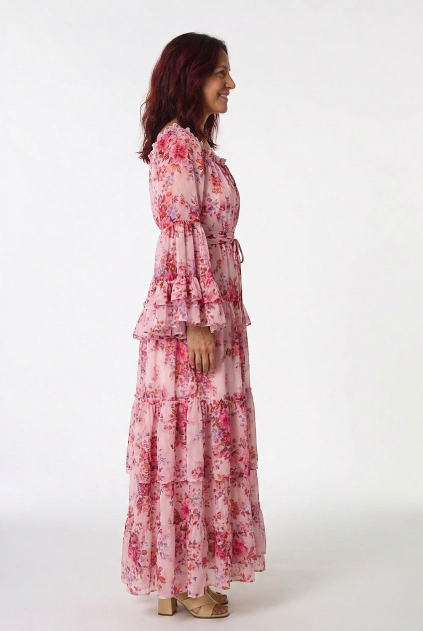Floral print bohemian maxi dress for women. Designed with playful ruffle bell sleeves & tie waist.