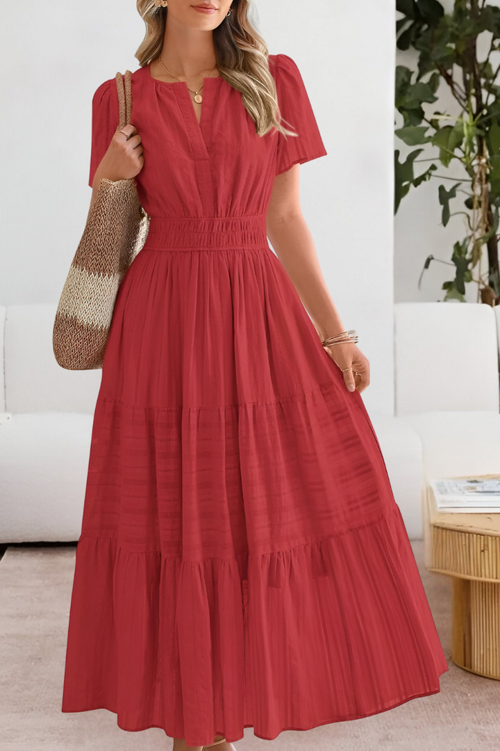 Stylish women's summer midi dress, bohemian inspired with a flattering smocked top and short sleeves.