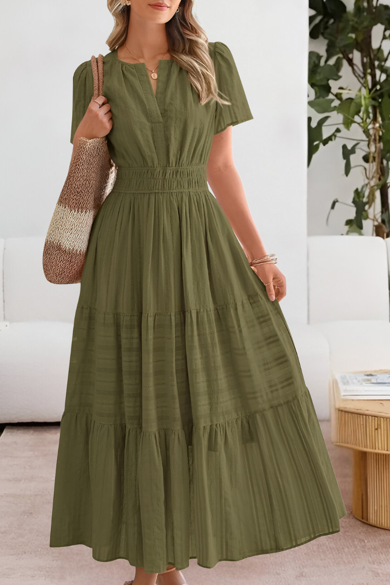 Lightweight women's bohemian midi dress, perfect for vacation, with smocked detail and short sleeves.