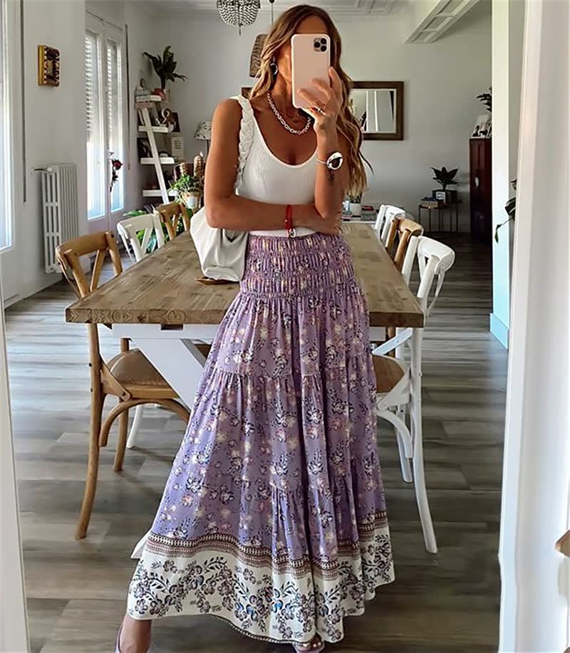 Printed bohemian tiered midi skirt for women, featuring a comfortable elastic waist and flowing summer style.