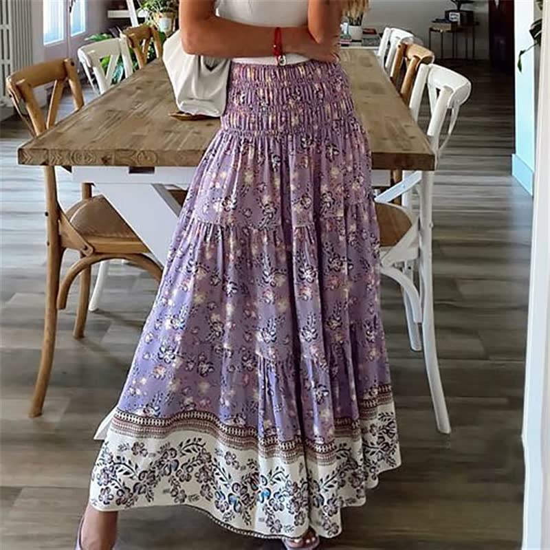 Flowing women's tiered midi skirt with elastic waist, ideal for summer, casual wear, or bohemian vacation fashion.