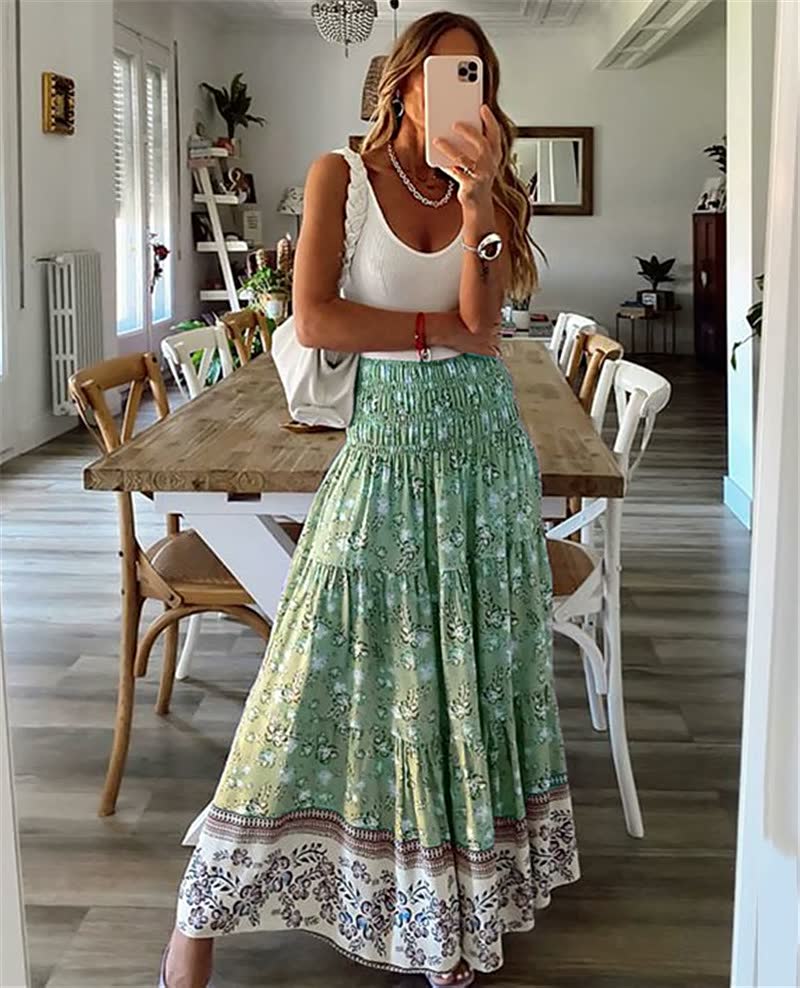 Elegant women's flowing bohemian midi skirt with tiered design & elastic waist, great for summer fashion.