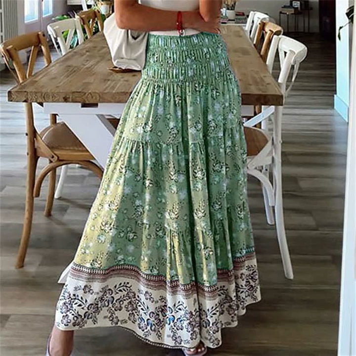 Bohemian tiered midi skirt for women with an elastic waist, offering a flowing and stylish summer look.