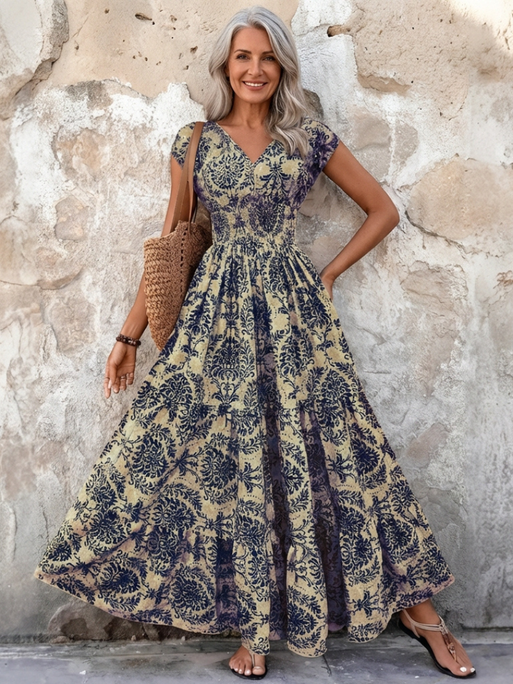 Women's bohemian V-neck maxi dress with cap sleeves. Perfect for summer, beach, or casual elegant events.