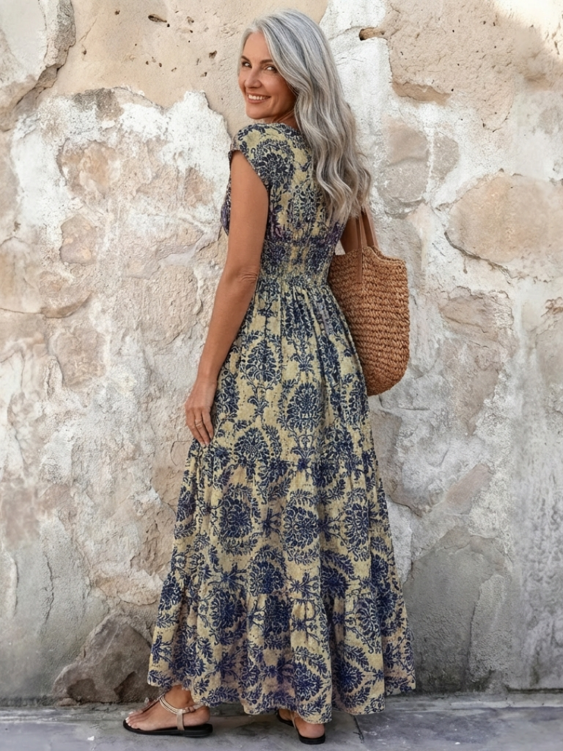 Elegant women's cap sleeve V-neck maxi dress. This bohemian summer dress has a tiered skirt, great for events.