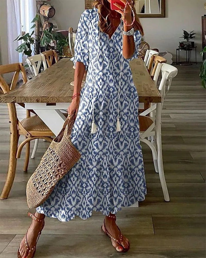 Women's boho A-line midi dress with V-neck, lantern sleeves, and flattering geometric print, perfect for summer.