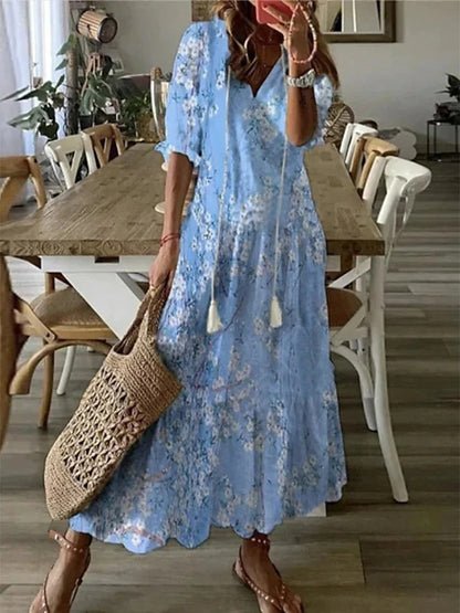 Women's flattering bohemian A-line dress, midi length, with distinct lantern sleeves and vibrant geometric print.