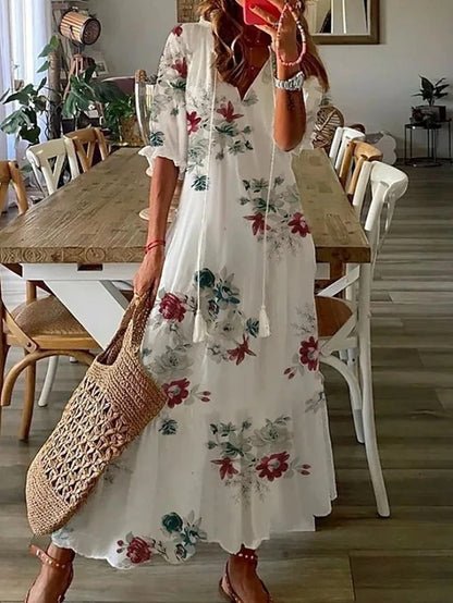 Stylish women's summer boho dress, midi length, V-neck, lantern sleeves, and flattering geometric print design.