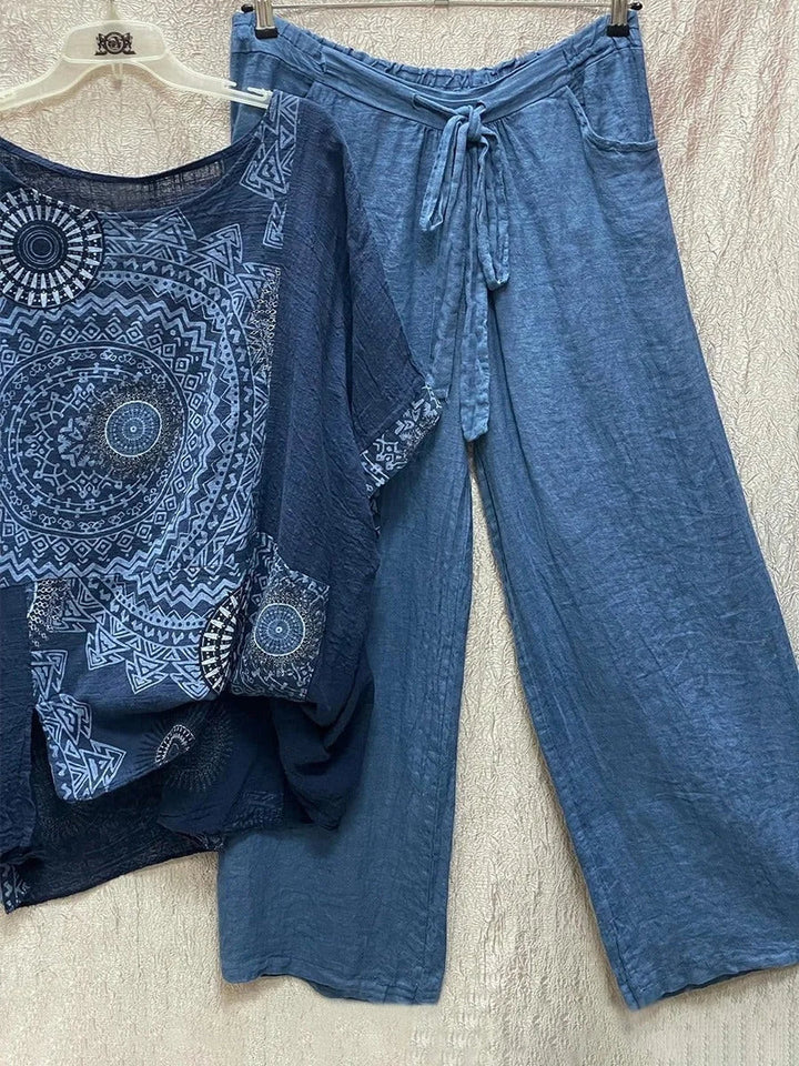 Women's summer fashion: mandala print top and flowy wide-leg pants set with an adjustable drawstring waist for comfort.