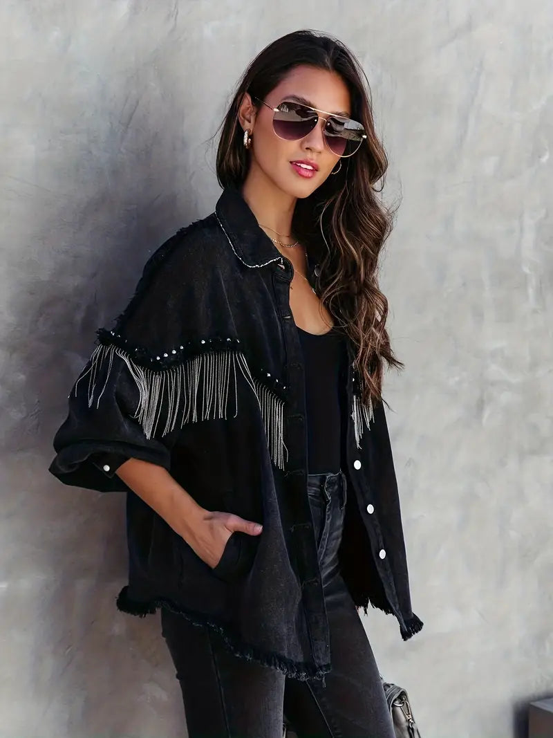 Studded women's denim jacket featuring bohemian fringe, ideal for spring, autumn, or a western-inspired statement.