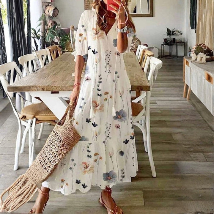 Women's boho floral maxi dress with short sleeves, perfect for summer beach or casual wear. Flowy bohemian style.