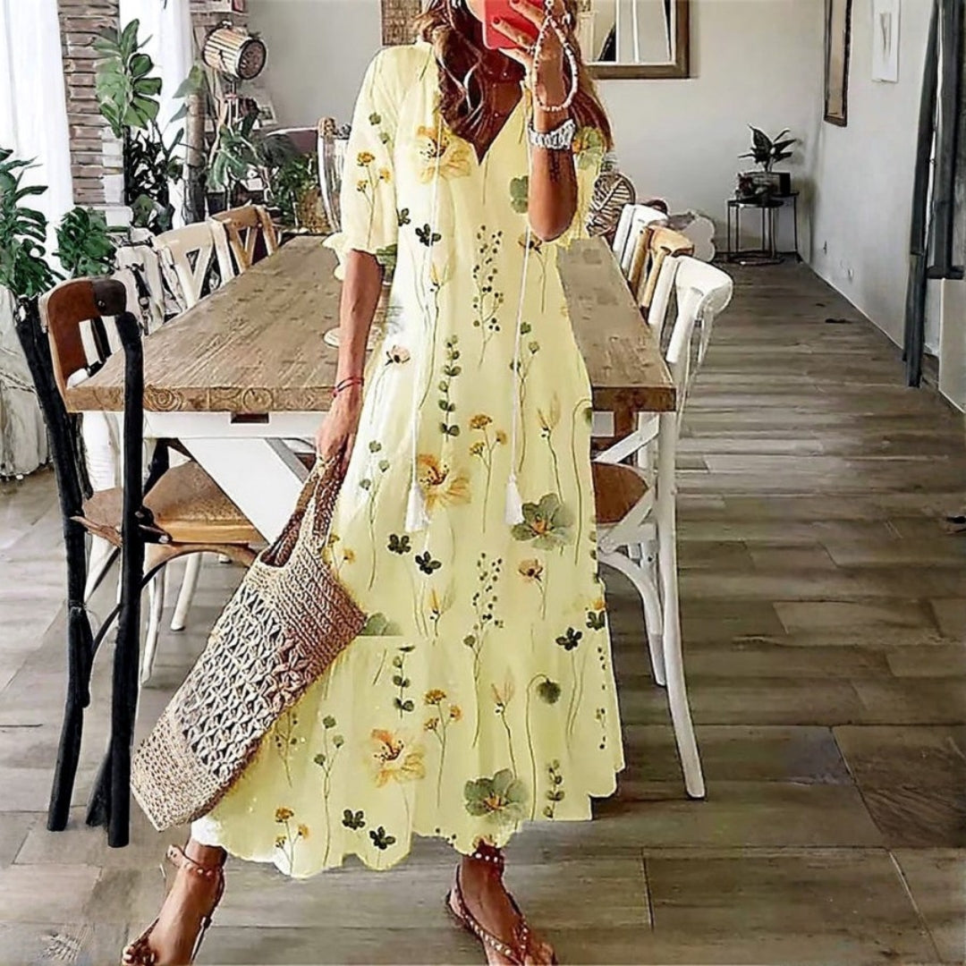 Elegant women's short sleeve floral print maxi dress. Ideal bohemian vacation or summer beach fashion. Comfortable flowy fit.