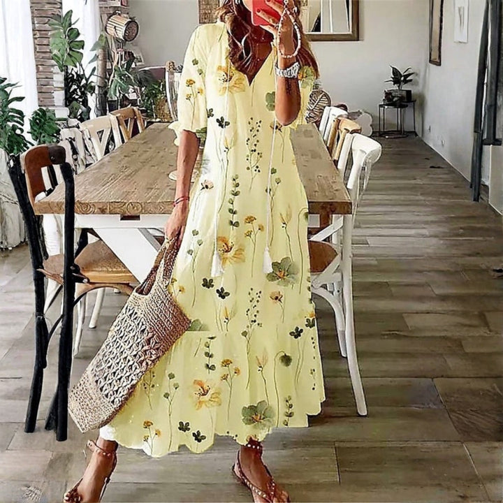 Elegant women's short sleeve floral print maxi dress. Ideal bohemian vacation or summer beach fashion. Comfortable flowy fit.