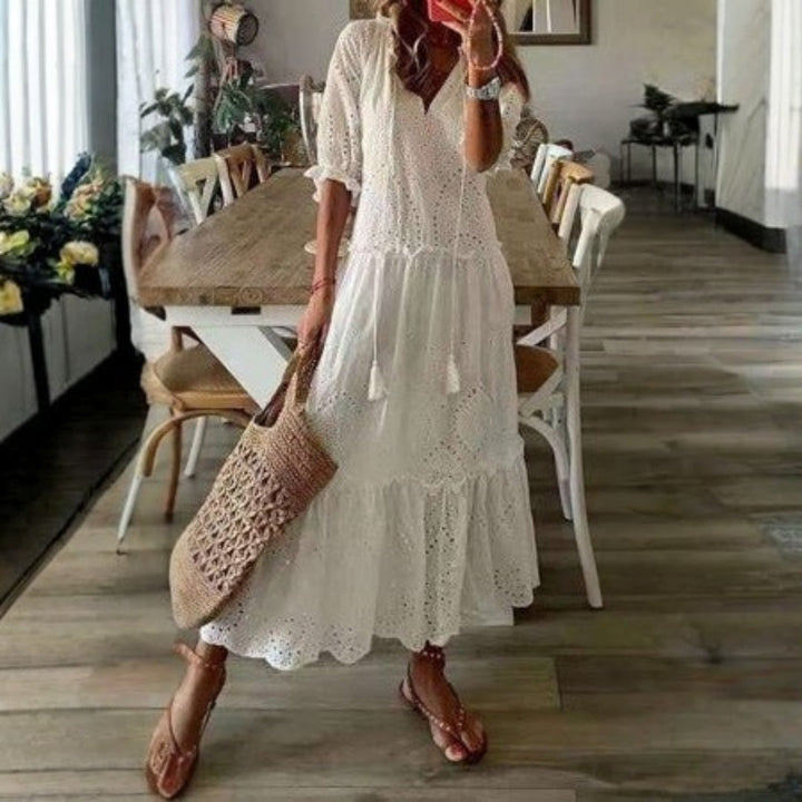 Women's vibrant floral print boho maxi dress with short sleeves. Flowy bohemian style, great for summer fashion and casual wear.