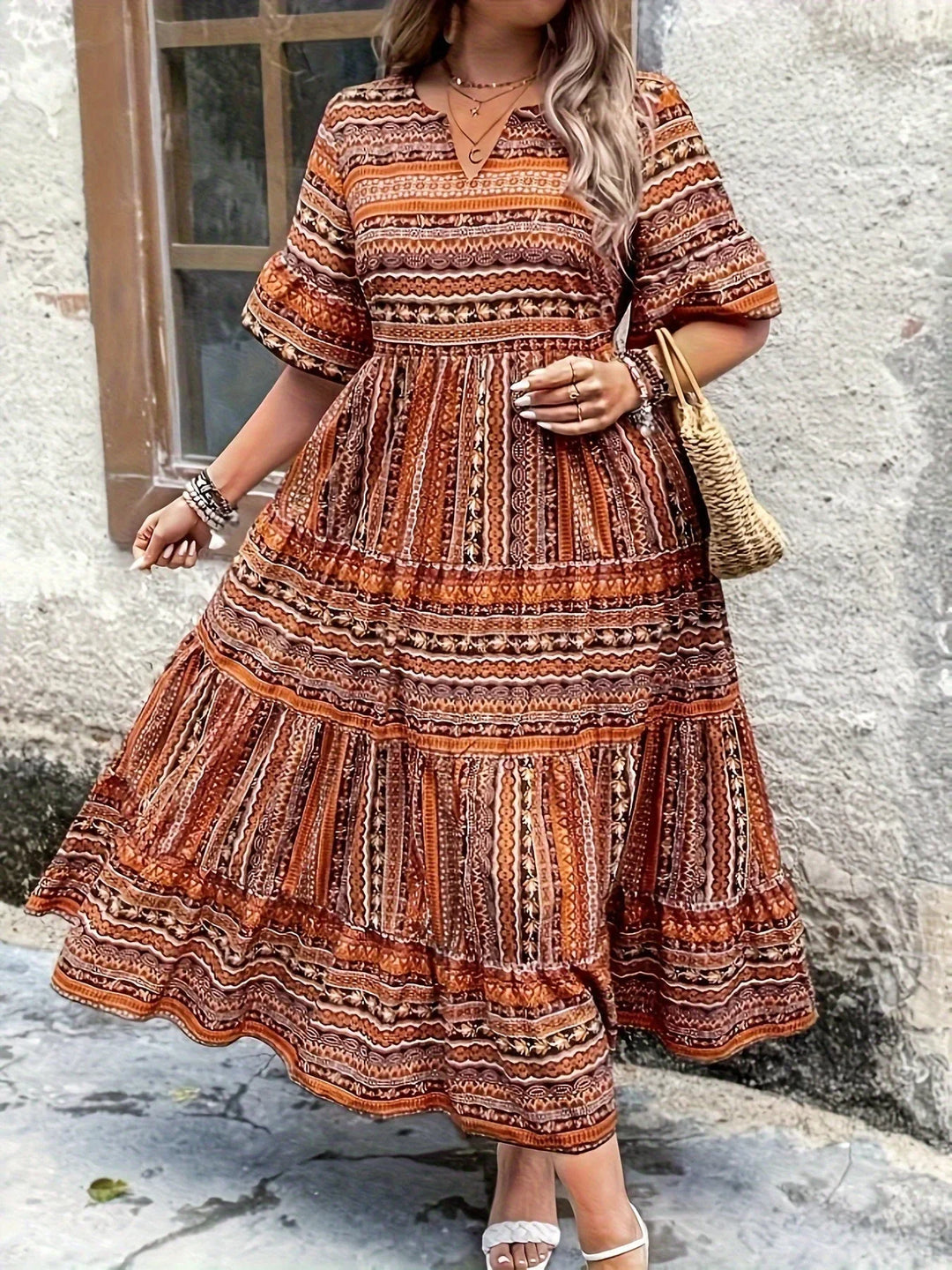 Versatile women's flowy maxi dress, V-neck, flutter sleeves, suitable for casual or elegant occasions.
