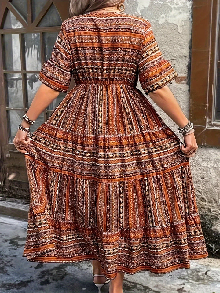 Full-length women's boho V-neck maxi dress with soft flutter sleeves, a perfect long summer dress.