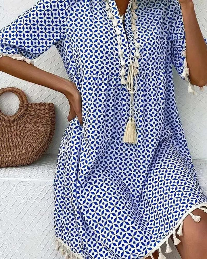 Stylish women's geometric print mini tunic dress, ideal as a beach cover-up or casual summer outfit.