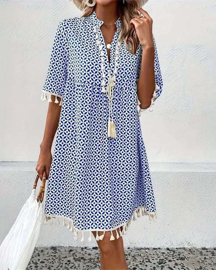 Casual women's boho mini tunic dress with a vibrant geometric print, comfortable for everyday summer wear.