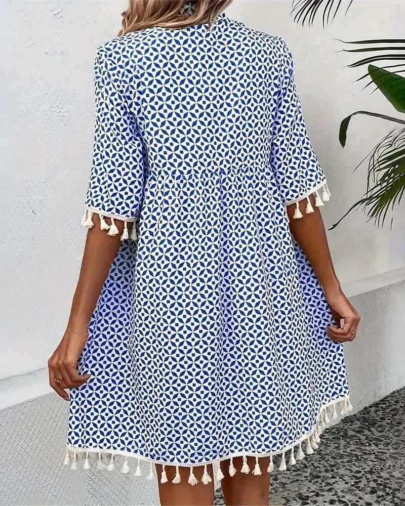 Vibrant geometric print mini tunic dress for women, offering a relaxed boho fit, perfect for warm weather fashion.