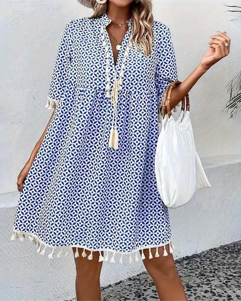 Women's resort wear mini tunic dress with a captivating geometric print, perfect for summer vacations and pool days.
