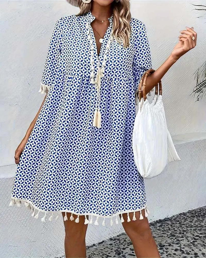 Women's resort wear mini tunic dress with a captivating geometric print, perfect for summer vacations and pool days.