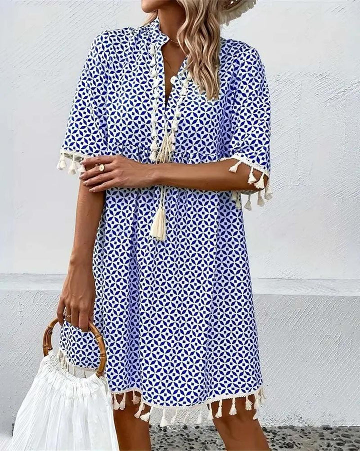 Versatile women's boho geometric print mini tunic dress, great for beach days, casual outings, or resort wear.