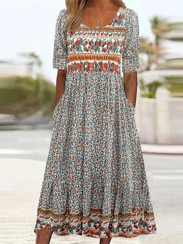 Women's boho midi dress, flowing short sleeve, bohemian style for summer and casual everyday wear.