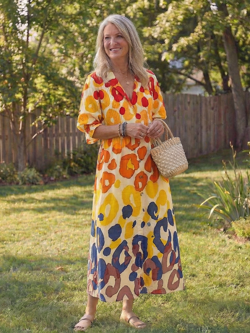 Stylish women's midi dress, button-front, featuring a vibrant floral print and relaxed bohemian aesthetic.