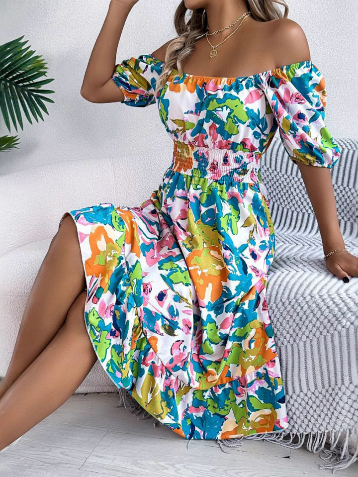 Stylish off-shoulder boho mini dress for women. Features smocked waist, puff sleeves, & a comfortable summer fit.