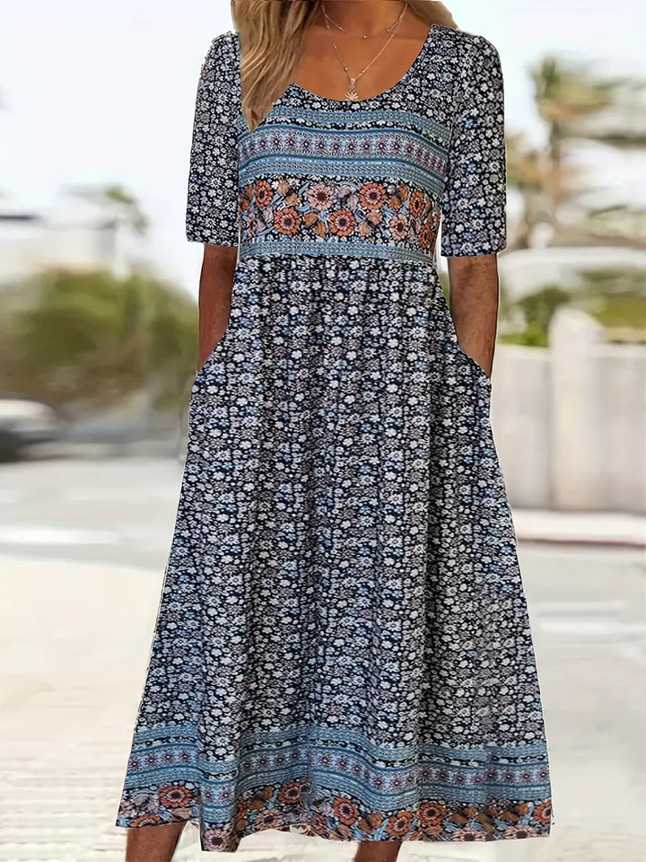 Free-spirited women's boho print dress, midi length, shirred top, suitable for casual outings.