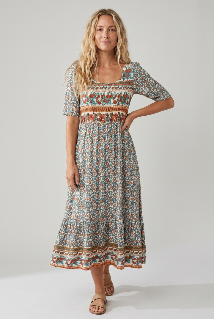 Free-spirited tiered midi dress, bohemian print, flattering shirred top, sleeveless.