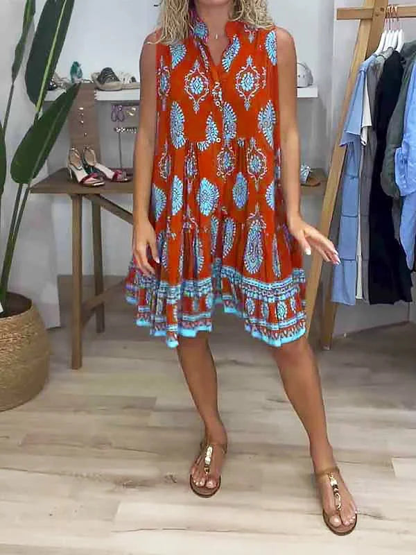 Stylish sleeveless V-neck boho mini dress with colorful print and tiered hem, ideal for summer vacations.
