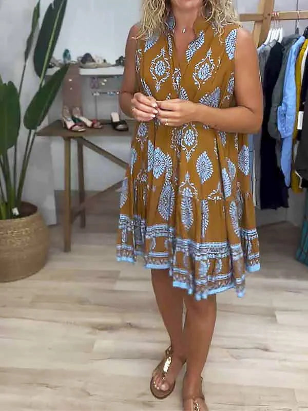 Trendy women's sleeveless boho mini dress with vibrant print, V-neckline, and flowy tiered hem. Women's fashion.