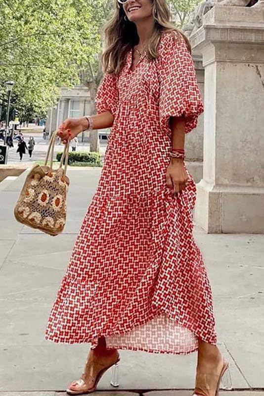Long bohemian V-neck maxi dress for women, with delicate puff sleeves and a rich floral pattern.