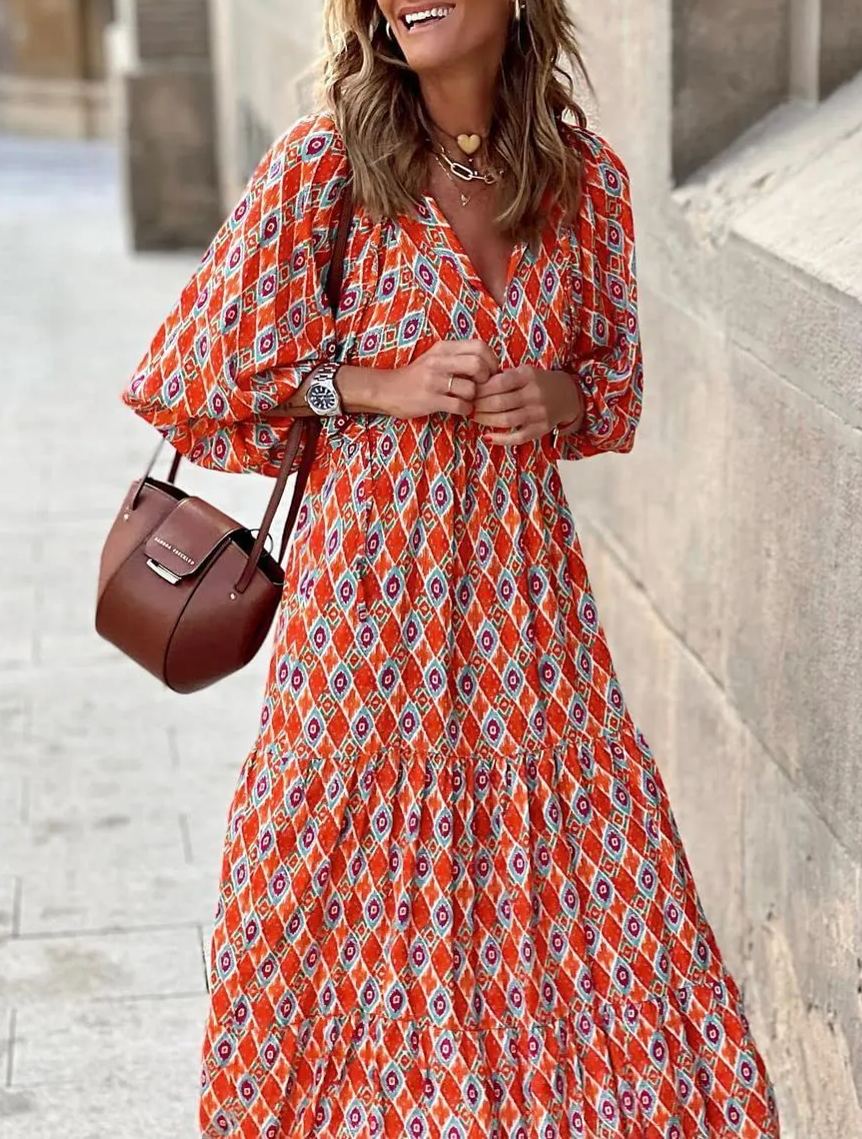 Summer women's maxi dress: intricate floral print, puff sleeves, and a comfortable V-neck.