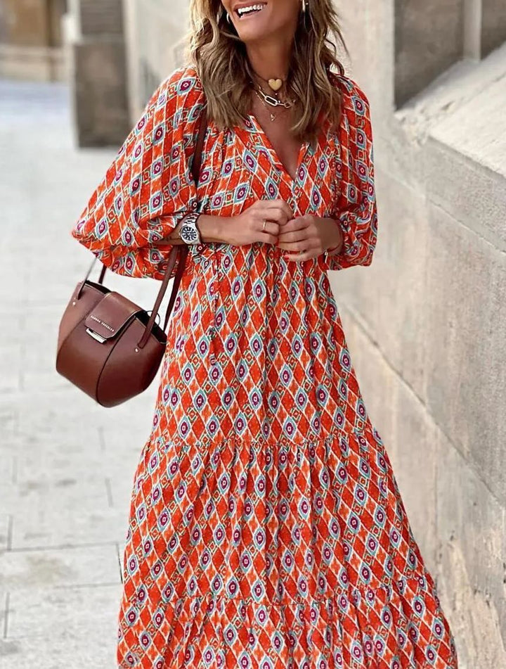 Summer women's maxi dress: intricate floral print, puff sleeves, and a comfortable V-neck.