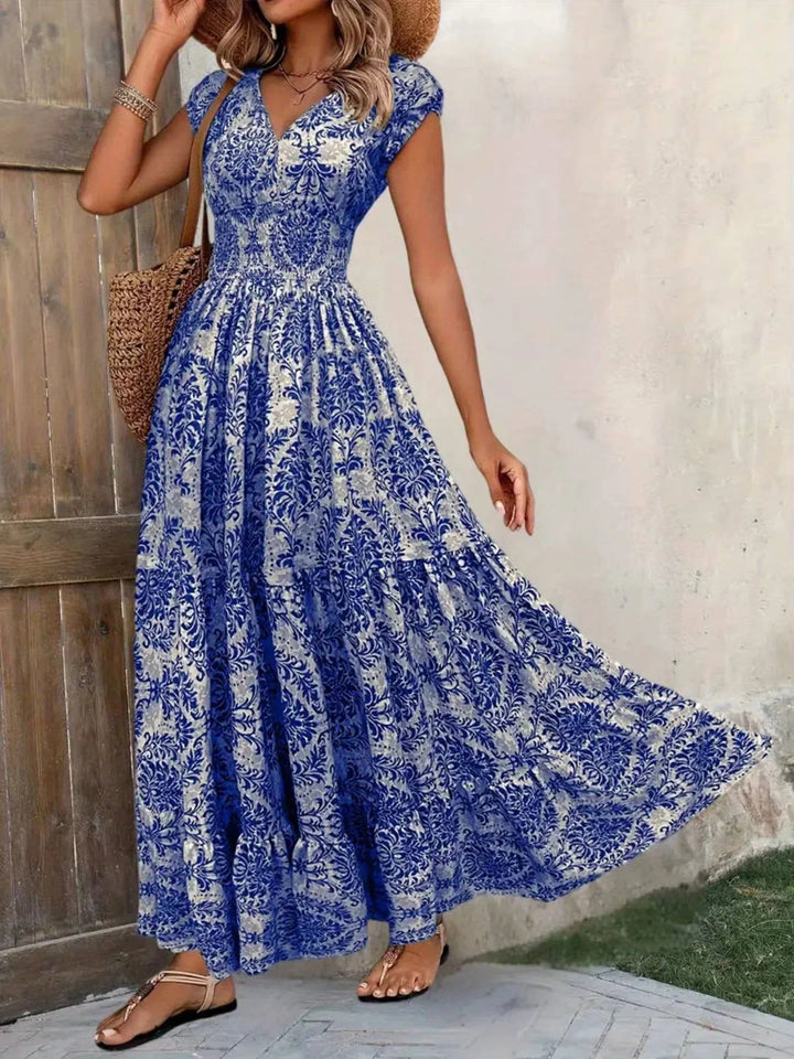 Summer-ready women's V-neck cap sleeve maxi dress, smocked tiered boho design.