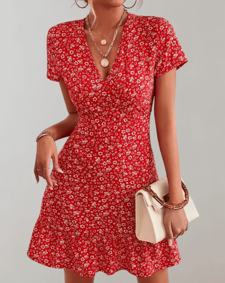 Women's boho summer midi dress with vibrant floral pattern. Perfect flowing sleeveless casual wear for vacation outfits.