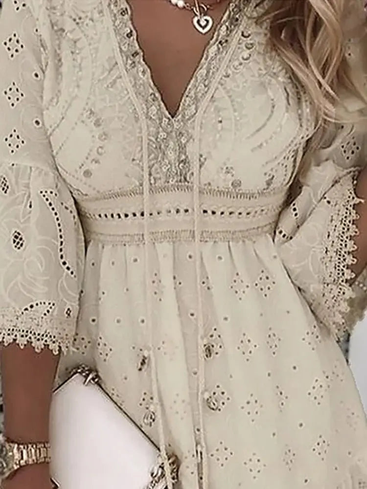 Elegant women's bohemian mini dress, flowy V-neck with intricate embroidered lace bell sleeves, ideal for vacation.