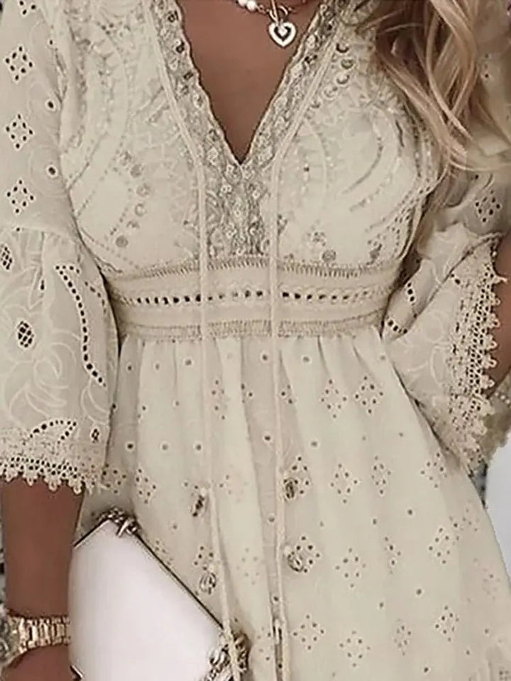 Elegant women's bohemian mini dress, flowy V-neck with intricate embroidered lace bell sleeves, ideal for vacation.