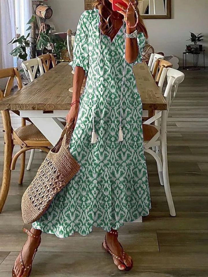 Printed V-neck maxi dress for women, ideal for beach, vacation, or casual summer wear.