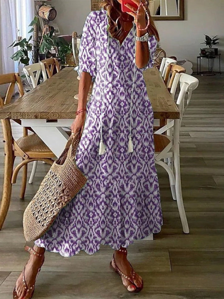 Bohemian style women's V-neck summer dress, lightweight & flowy for ultimate comfort.