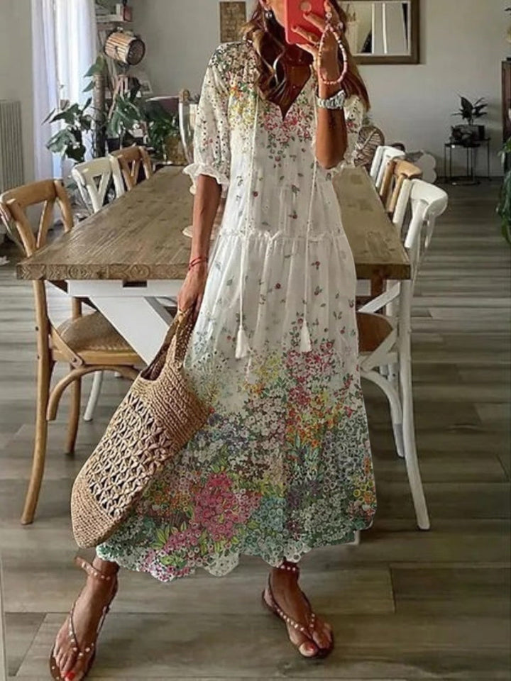 Flowy women's boho V-neck summer dress, a chic printed maxi for casual and beach outfits.