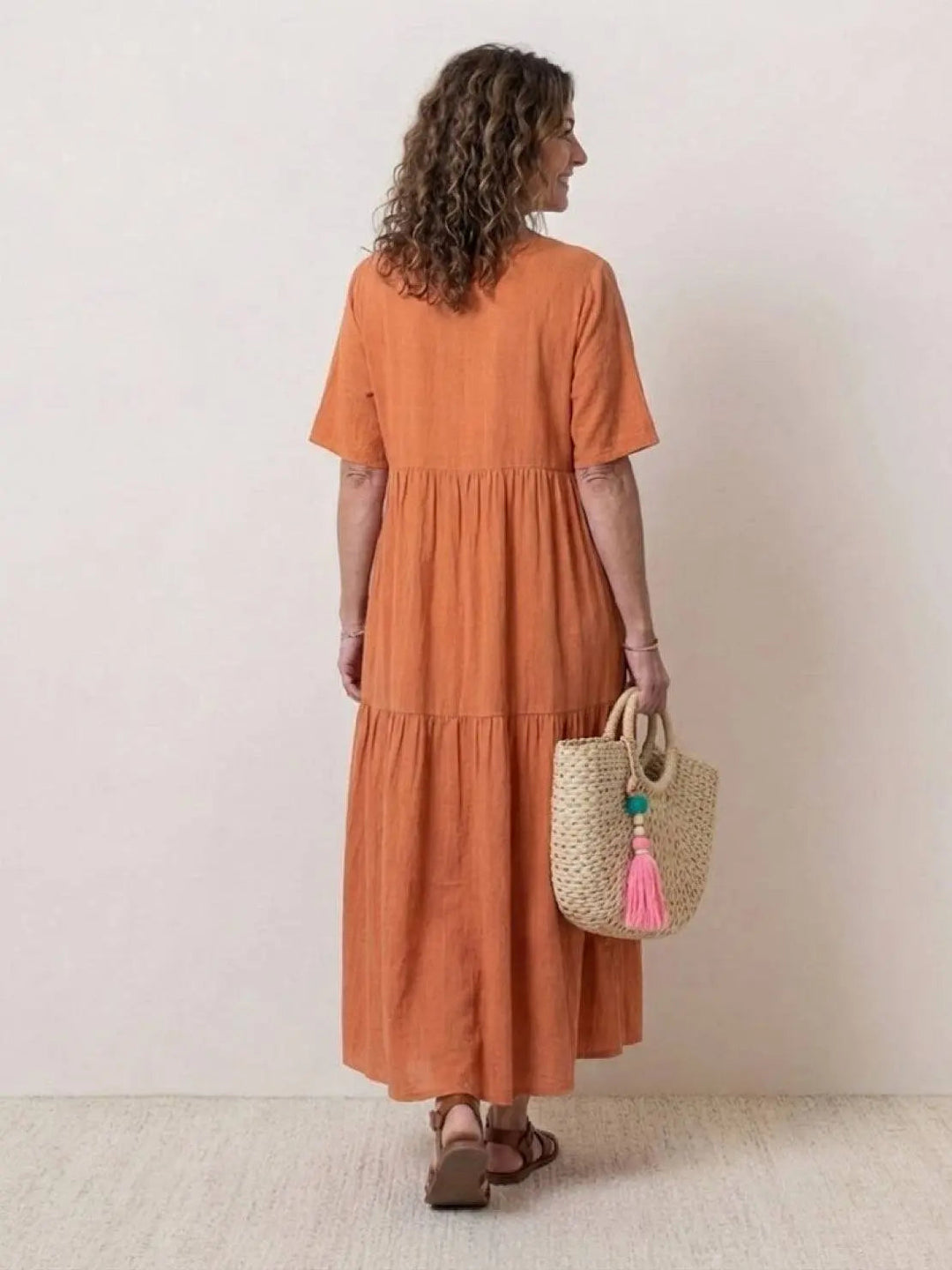 Women's casual V-neck maxi dress, tiered bohemian style, perfect beach wear.