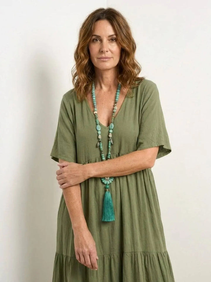 Bohemian swing dress, V-neck, tiered, women's loose fit maxi for beach days.