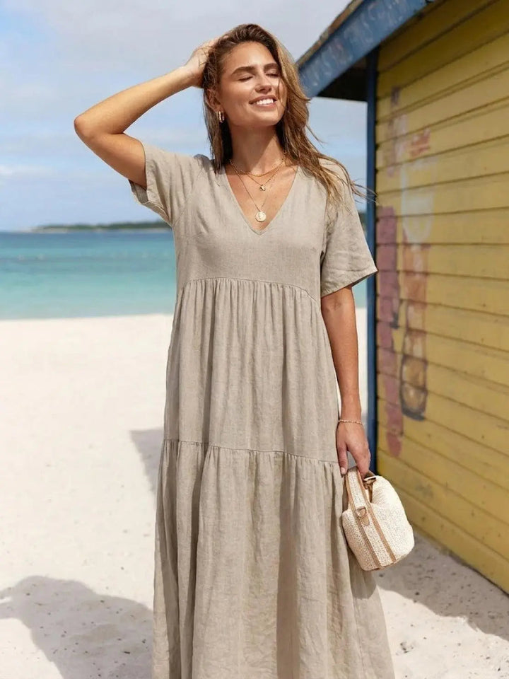 Stylish women's tiered maxi dress, boho V-neck design, perfect for summer.