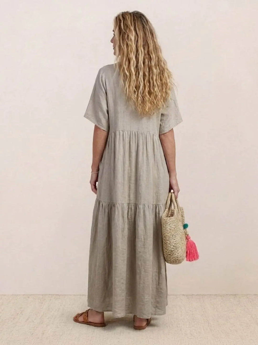 Chic women's summer fashion, V-neck tiered maxi swing dress, bohemian flair.