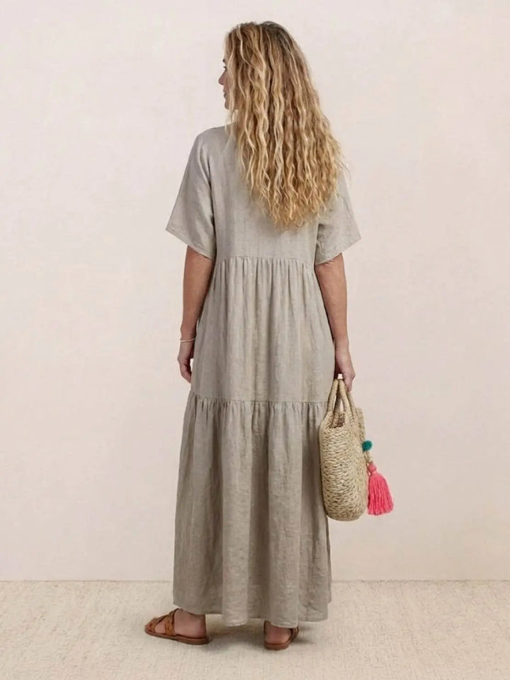 Chic women's summer fashion, V-neck tiered maxi swing dress, bohemian flair.